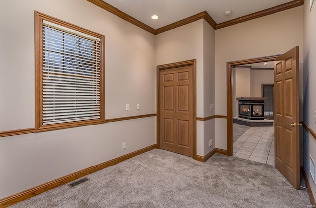 unfurnished room with light carpet and ornamental molding