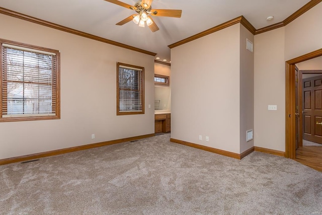 spare room featuring light carpet, ceiling fan, and ornamental molding