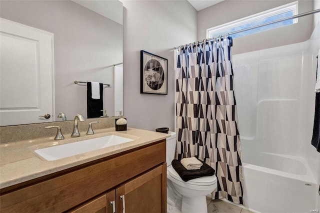 full bathroom with toilet, vanity, and shower / tub combo with curtain