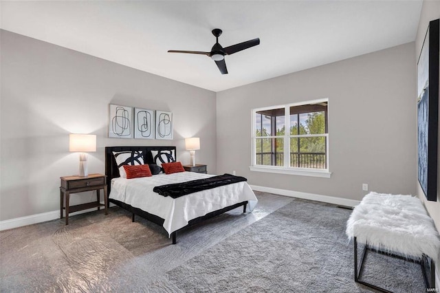 bedroom featuring dark carpet and ceiling fan