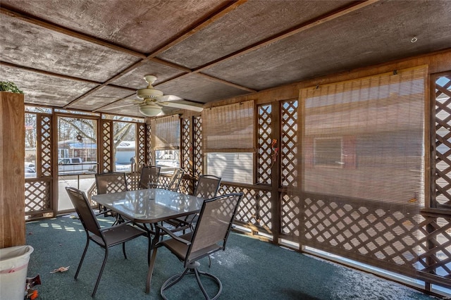 exterior space featuring coffered ceiling and ceiling fan