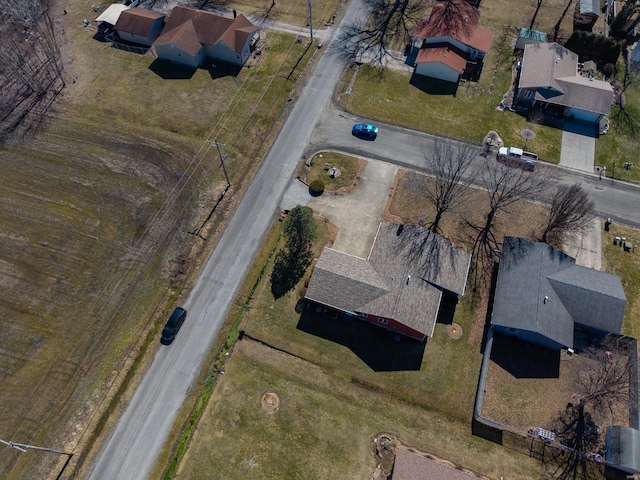 birds eye view of property with a residential view