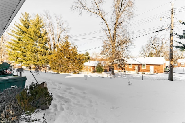 view of yard covered in snow