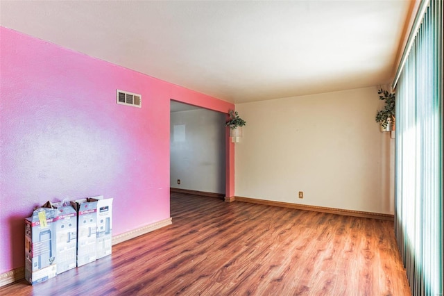 unfurnished room featuring hardwood / wood-style floors