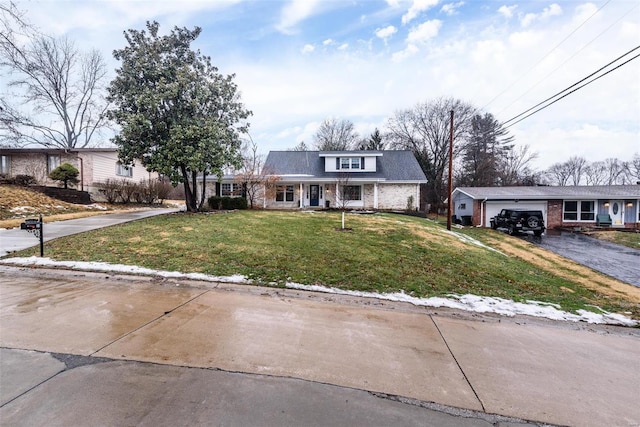 view of front of home featuring a garage and a front lawn