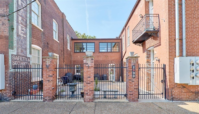 view of front of house featuring a balcony