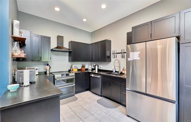 kitchen with stainless steel appliances, sink, light tile patterned floors, and wall chimney exhaust hood