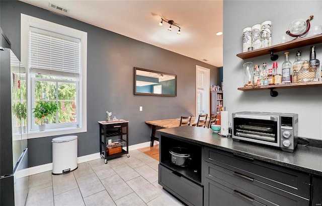 kitchen with light tile patterned floors