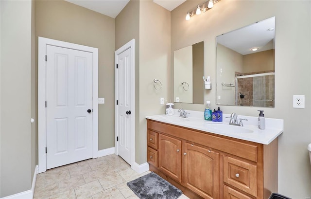 bathroom featuring vanity, tile patterned floors, and walk in shower