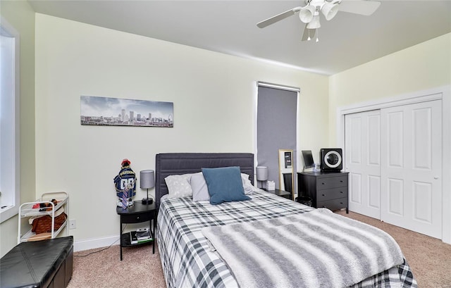 bedroom featuring a closet, ceiling fan, and carpet floors