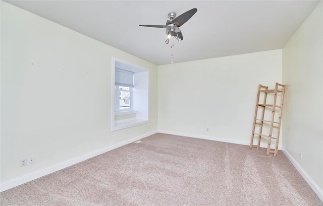 carpeted empty room with ceiling fan