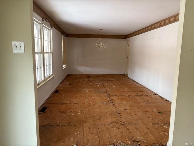 empty room featuring a chandelier