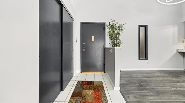 corridor featuring light tile patterned floors