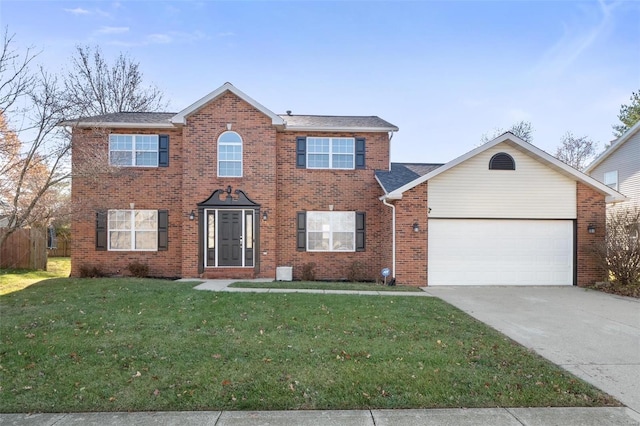 colonial-style house with driveway, brick siding, a front lawn, and an attached garage