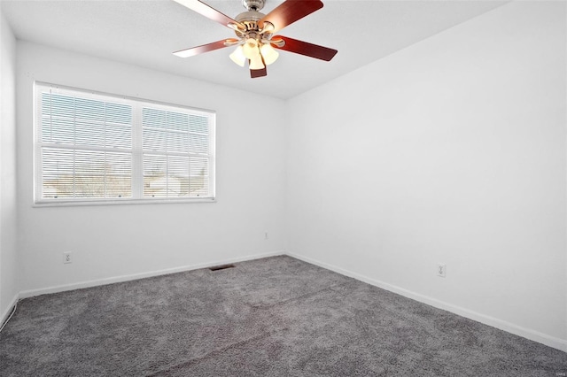 empty room featuring ceiling fan and carpet floors