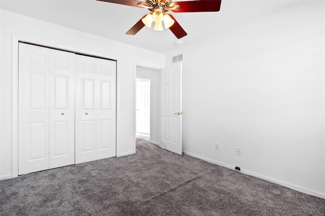 unfurnished bedroom with ceiling fan, a closet, and carpet floors