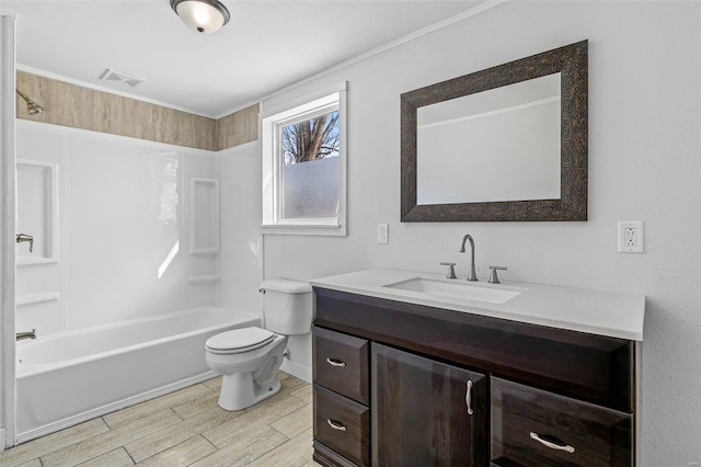 full bathroom featuring washtub / shower combination, toilet, and vanity