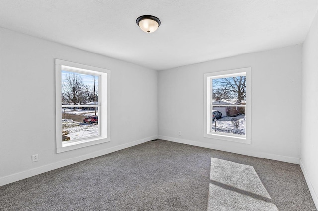 spare room with carpet floors