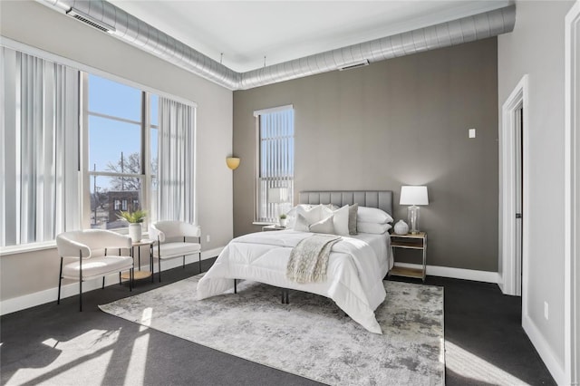 bedroom with visible vents and baseboards