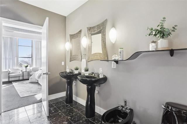 room details with a bidet, ensuite bath, and baseboards