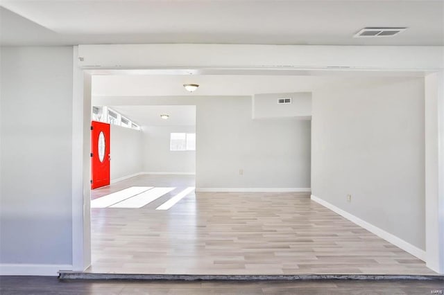 unfurnished room with hardwood / wood-style floors