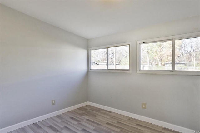 unfurnished room featuring light hardwood / wood-style flooring