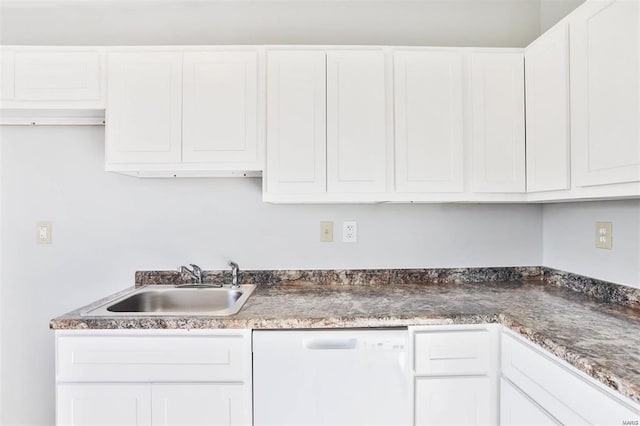 kitchen with sink, white dishwasher, and white cabinets