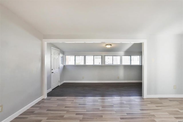 empty room featuring wood-type flooring