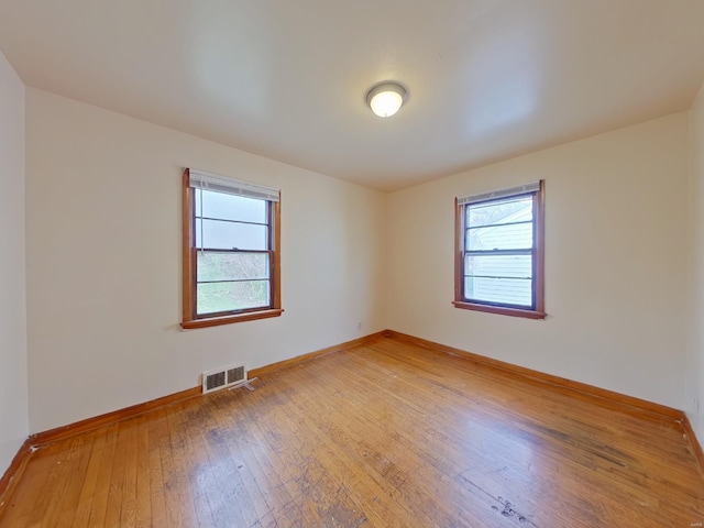 spare room featuring hardwood / wood-style flooring