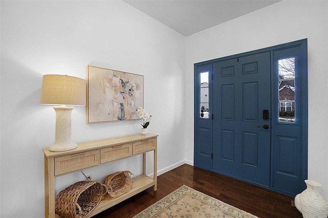 foyer with dark hardwood / wood-style floors