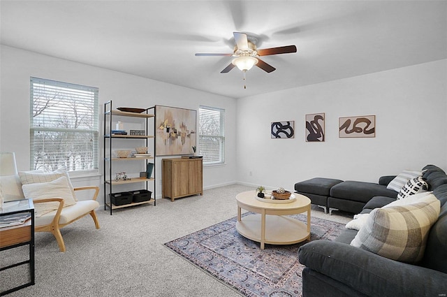 carpeted living room with ceiling fan and a wealth of natural light