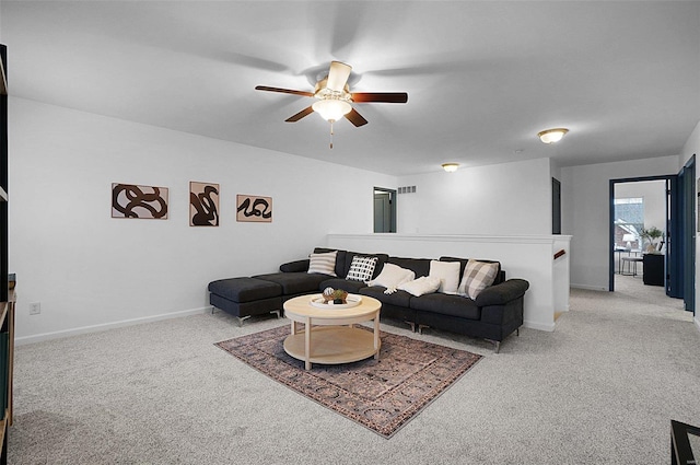 living room featuring light carpet and ceiling fan