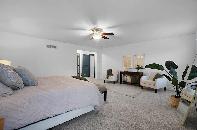 bedroom with ceiling fan and light colored carpet