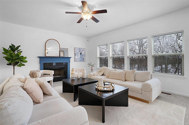 living room featuring ceiling fan and light carpet