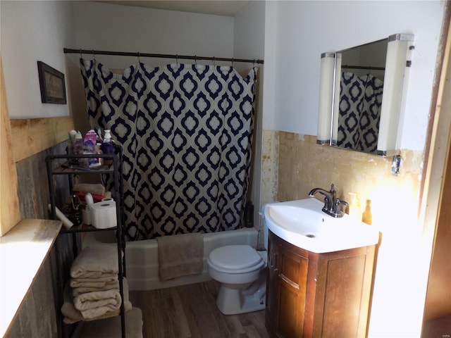 full bathroom featuring vanity, toilet, shower / bath combo with shower curtain, and wood-type flooring