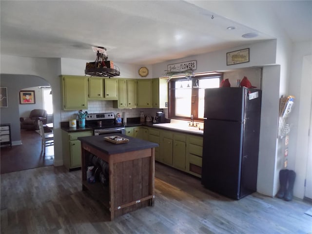 kitchen with dark wood-type flooring, electric range, black refrigerator, and green cabinets