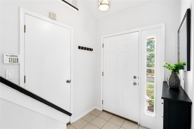 foyer entrance featuring light tile patterned floors