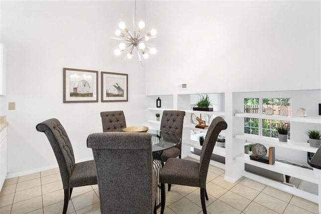 dining space with built in shelves, light tile patterned flooring, and an inviting chandelier