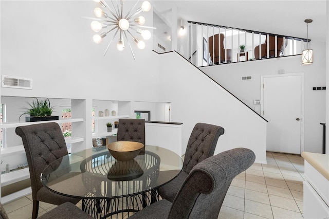 tiled dining room with built in shelves and an inviting chandelier