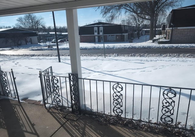 view of yard layered in snow