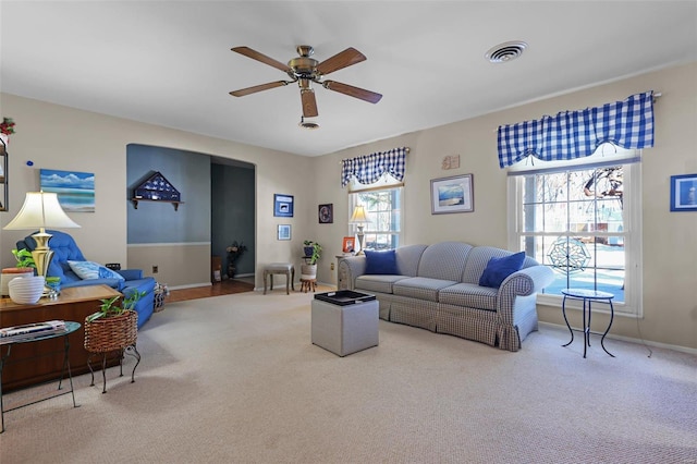 living room featuring ceiling fan and carpet flooring