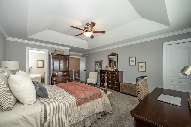 bedroom featuring ensuite bathroom, ceiling fan, carpet, a raised ceiling, and ornamental molding