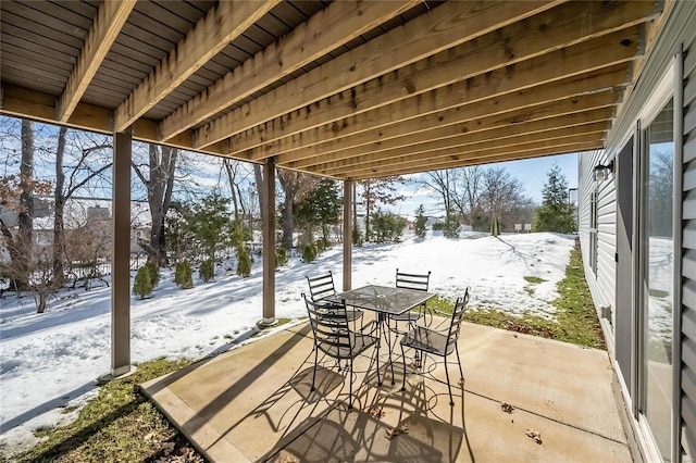 view of snow covered patio