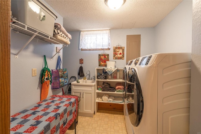 laundry room with cabinets, separate washer and dryer, and a textured ceiling