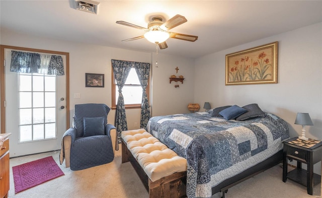 bedroom featuring light colored carpet and ceiling fan