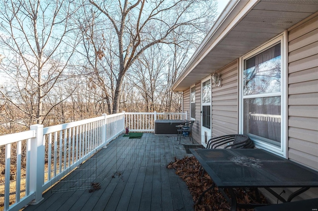 wooden deck featuring a jacuzzi