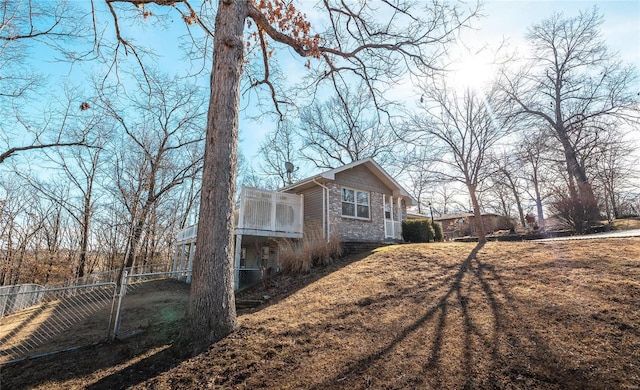 view of home's exterior with a yard and a sunroom