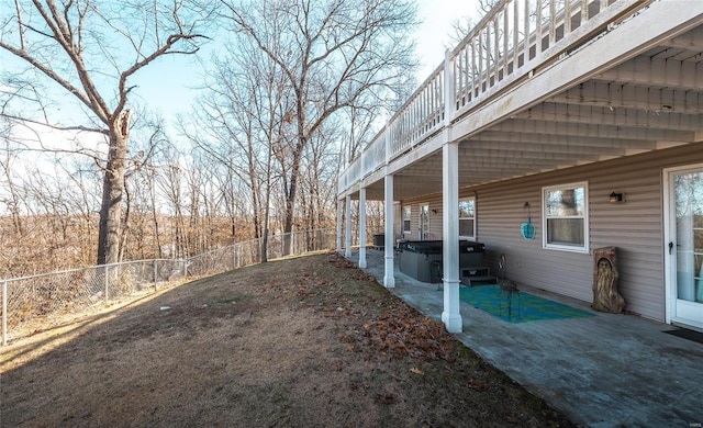 view of yard with a hot tub and a patio area