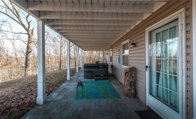 view of patio with a hot tub