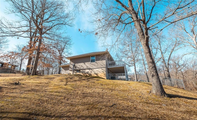 view of property exterior featuring a lawn